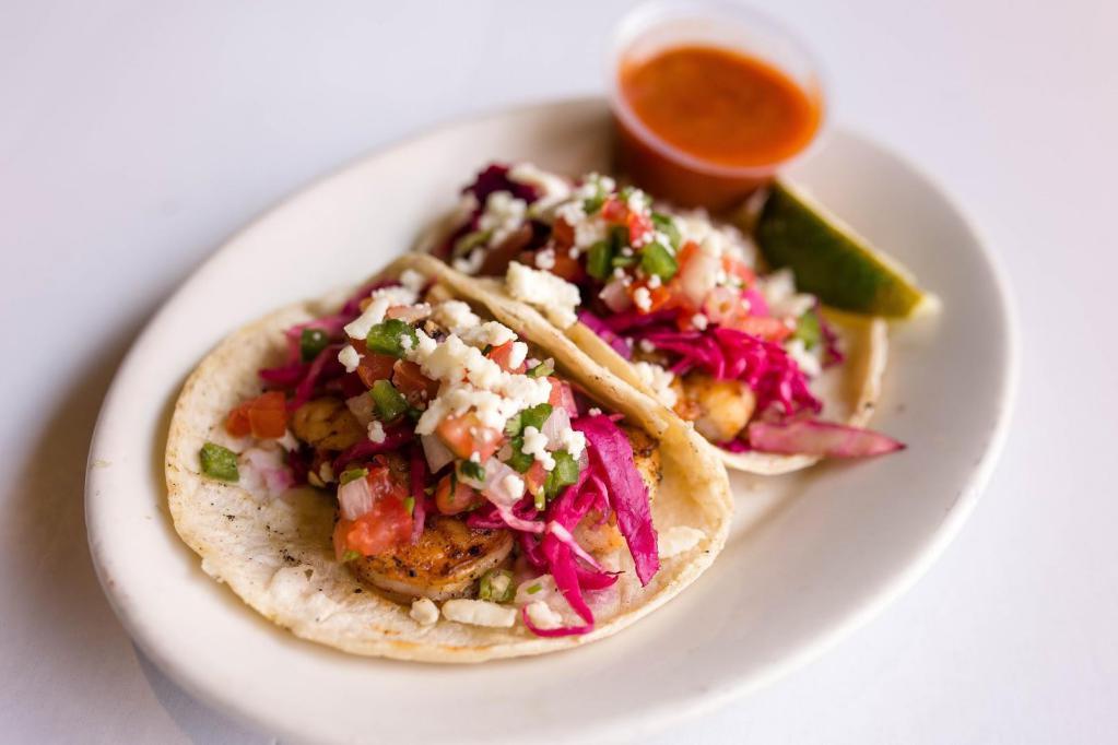 Seafood Tacos (4) · Tacos dressed with seasoned red cabbage, pico de gallo, queso fresco, and our delicious homemade chipotle sauce!