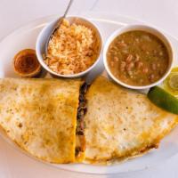 Taco Pirata · Carne Asada in a large flour tortilla smothered in mozzarella cheese, grilled onions, and mu...