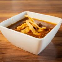 Hot and Sour Soup · Tasty peppery flavored soup that includes Tofu, Wonton Skins, and Black mushrooms.