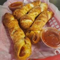 Pizza Styx · Sticks of our fresh made pizza dough, rolled, stuffed with pepperoni and our mozzarella blend
