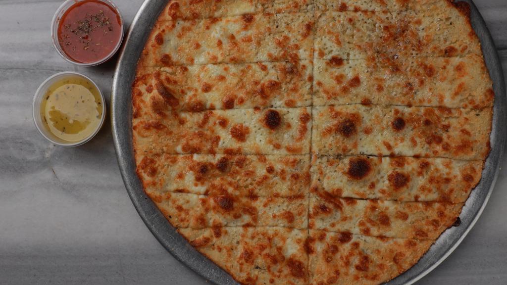 The Primo Cheesy Bread · Our fresh made dough, garlic oil, and our special cheese blend baked to perfection, served with marinara
