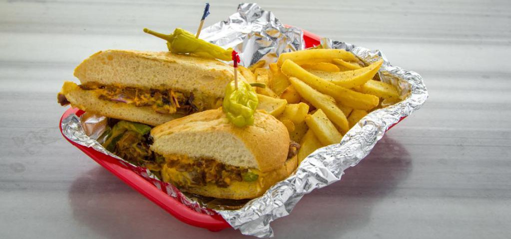 Philly Sub · Philly cheesesteak, mushrooms, green peppers, onions, cheese whiz, provolone cheese. Served with crispy fries