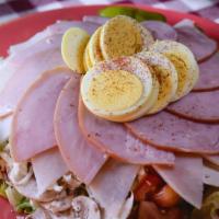 Large Chef Salad · Sliced ham and turkey with a healthy serving of olives, mushrooms, eggs and topped with mozz...
