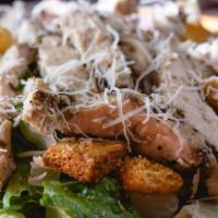 Large Chicken Caesar Salad · Romaine lettuce and our grilled chicken tossed in Caesar dressing topped with shaved Parmesa...