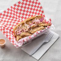 Grilled Chicken Po'boy Sandwich · The humble grilled chicken gets a makeover in this Po'boy.  Dusted with a little bit of a Ca...