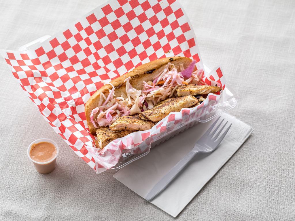 Grilled Chicken Po'boy Sandwich · The humble grilled chicken gets a makeover in this Po'boy.  Dusted with a little bit of a Cajun kick and topped with tangy homemade coleslaw, this ain't your average grilled chicken sandwich.