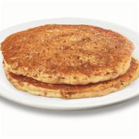 Stack of Hearty 9 -Grain Pancakes · Multigrain wheat pancakes made with flaxseeds, cinnamon & brown sugar.