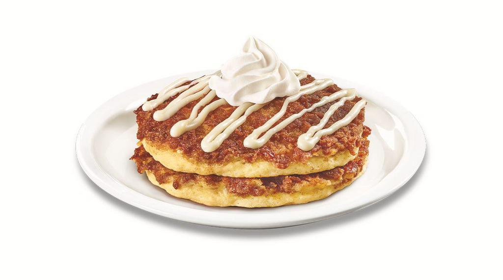 Stack of Cinnamon Roll Pancakes  · Buttermilk pancakes cooked with cinnamon crumb topping and topped with whipped cream and cream cheese icing. 