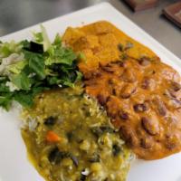 Vegan Entrée Plate · Each plate comes with rice, lentils, a small side of salad, and a roti. Our Photo is an exam...