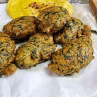 Bhajiya Pokura · Spinach, ground lentils, and Thai chilies diced, made into a batter and deep-fried. Kinda of...