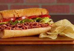 Cliff Hanger · A hearty oven-baked deli sandwich! We load a fresh roll with your choice of salami, ham, or Louisiana-style Hot Sausage, crisp lettuce, fresh tomato and melted cheese. Served with Chips. - (420-460 cal.)