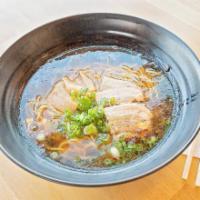 Shoyu Ramen · Soy based ramen with hick noodles and 2 slices of chashu, garnished with bamboo shoots and g...