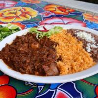 Birria de Res · Mexican stew made with beef, dried chiles, roasted tomatoes, herbs, onion, and cinnamon.