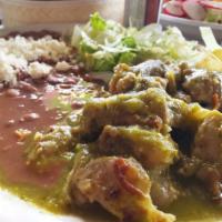 Costilllitas en Salsa · Ribs in red sauce. Pork ribs cooked in a savory red or green sauce.