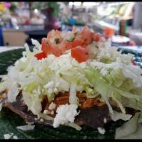 Tostada · Hardshell tortilla covered with beans, your choice of meat, lettuce, queso fresco (cheese), ...