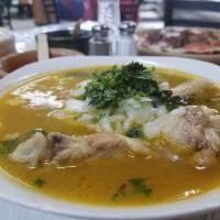 Chilate de Pollo · Chicken soup. Chicken in a spicy chile consteno broth with epazote leaves.