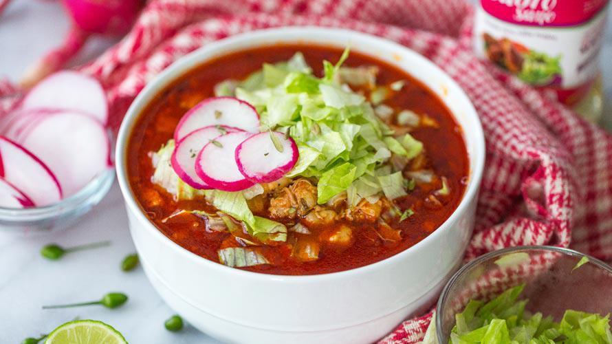 Pozole · Pork and hominy stew served with cabbage, radish, and onions on the side.