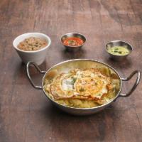 Chilaquiles · Homemade fried chips and green sauce with cheese and sour cream. Served with over easy egg a...