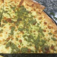 Pesto Pizza · No-sauce, extra mozzarella, Parmesan cheese, basil pesto sauce.