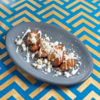 Sweet Plantains · Super-ripe sweet plantains topped with crema and queso fresco. Vegetarian.