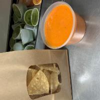 Chips & Salsa · A generous helping of our super awesome chips and our house salsas, Arbol and Salsa Verde!
