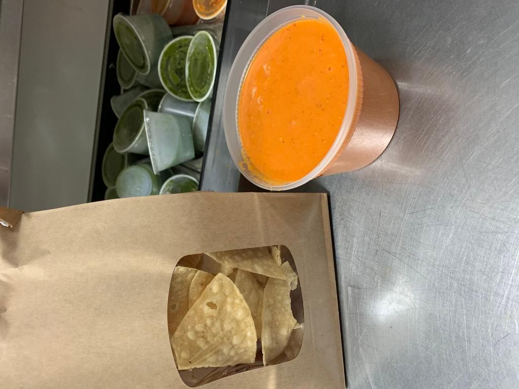 Chips & Salsa · A generous helping of our super awesome chips and our house salsas, Arbol and Salsa Verde!