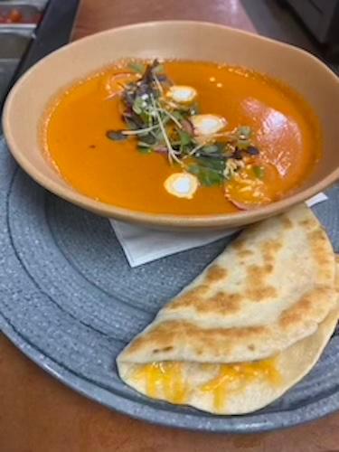 Tomato Soup · Roasted tomatoes, guajillo, seasonings. Mini cheddar quesadilla for dipping