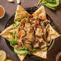 Gyro Salad · Fresh spinach and organic arugula served with pita bread, dressed with our signature honey b...