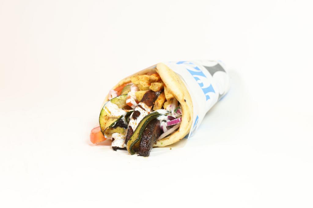 Veggie Pita · Grilled zucchini and mushrooms served on a warm pita bread filled with fries, tomatoes, onions, and tzatziki sauce.