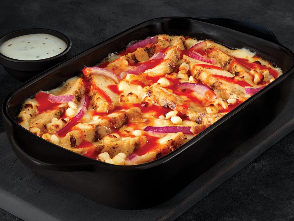 Buffalo Pizza Bowl · Crustless pizza baked in a bowl. Five fresh cheeses and bold Buffalo sauce topped with grilled all-white-meat chicken and freshly sliced red onions. Served with your choice of ranch or blue cheese dipping sauce.