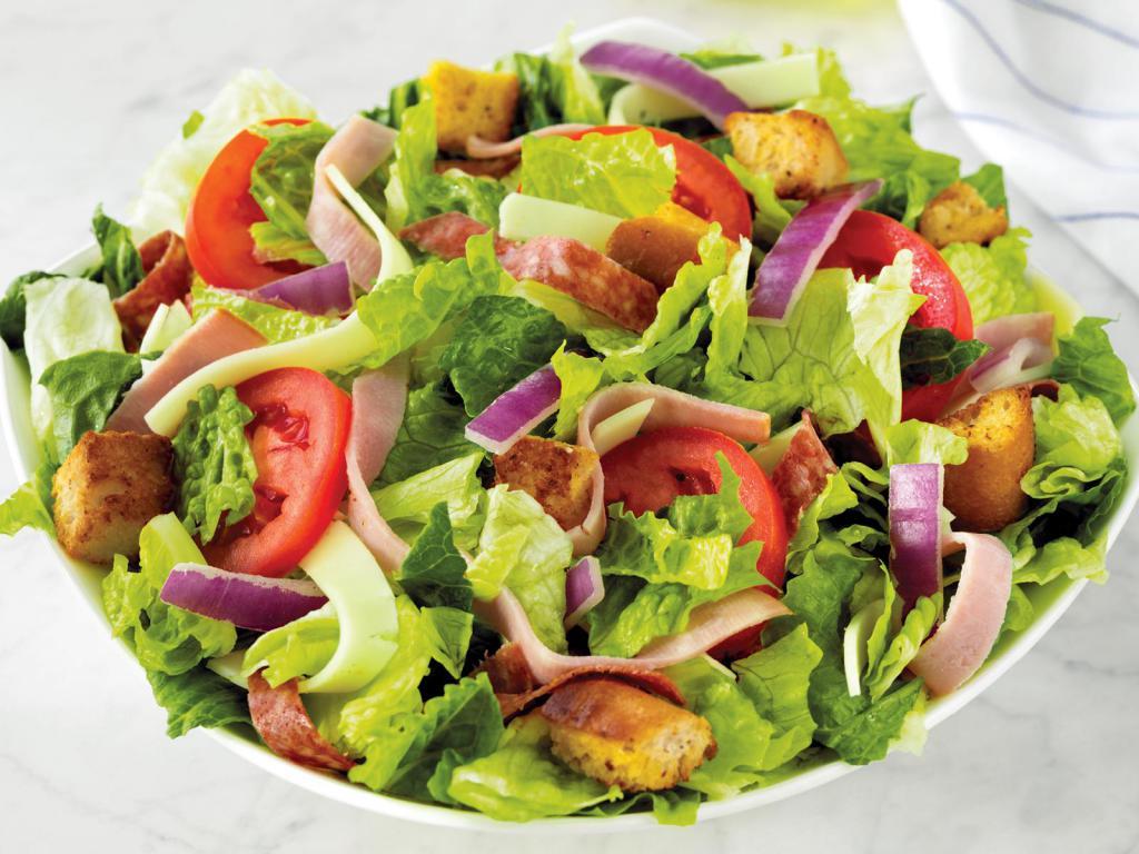 Italian Chef Salad · Fresh-cut lettuce blend, ham, salami, provolone cheese, sliced tomatoes, red onions, and croutons made daily; served with Italian dressing.