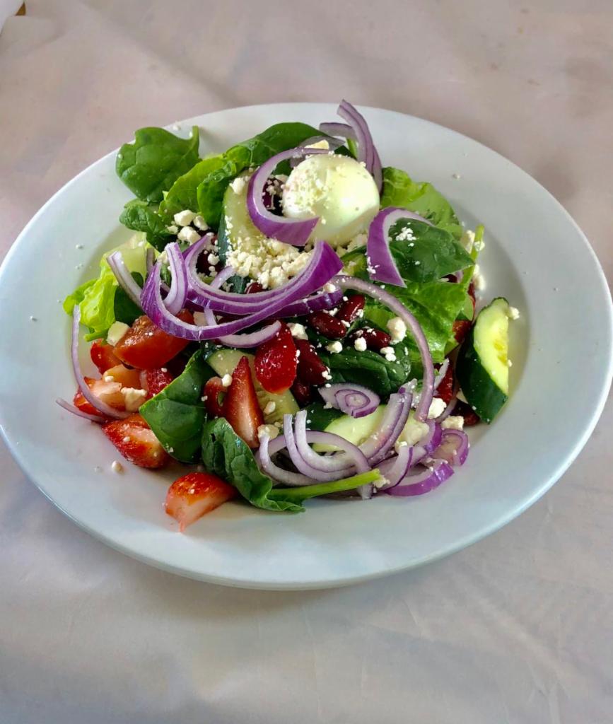 Greek Salad · Mixed greens, black olives, cucumbers, onions, tomatoes, green pepper, feta cheese, and Greek dressing.