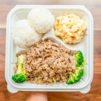 Kalua Pork with Cabbage · Slow roasted pork with a hint of smoky flavor, served shredded over steamed cabbage. Hawaii’...