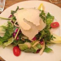 Insalata Mista con Parmigiano · Mixed organic greens with a lemon dressing and shaved Parmesan. 