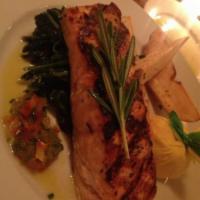 Salmone alla Griglia · Grilled salmon fillet served with sauteed spinach, roasted potatoes and sweet bell pepper re...