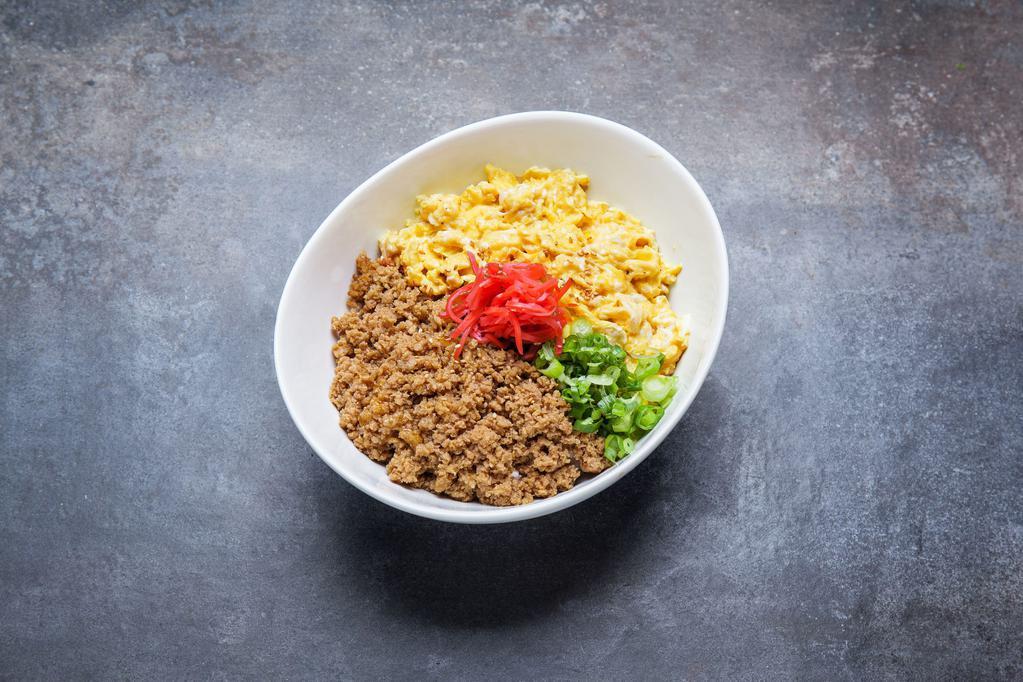 Soboro Bowl · Ground chicken with scrambled egg, green onion, red ginger, and sesame seeds over rice.