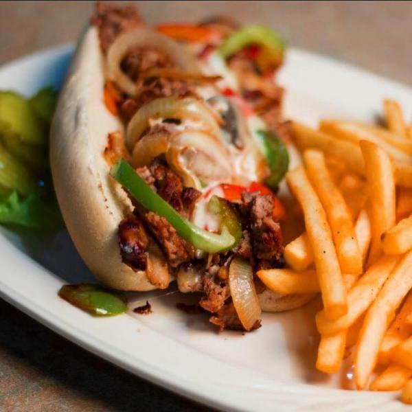 Philly Steak Sandwich · A combination of lean shaved philly steak, grilled onions and green peppers, smothered with melted monterey jack cheese and served on a lightly toasted hoagie roll.