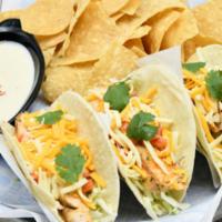 Chicken Tacos · Blackened chicken,  with green cabbage, cilantro, tomatoes, shredded cheese, and avocado lim...