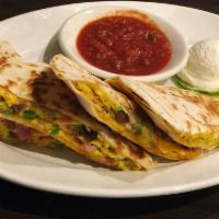 Farmers Quesadilla · Grilled tortilla stuffed with green peppers, onions, sausage, ham, bacon and eggs all scramb...