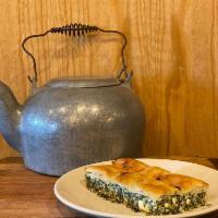 Spanakopita appetizer · Spinach pie. Filo stuffed with dpinach and feta then baked until golden brown.