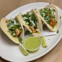 shrimp plancha tacos (3) · marinated grilled shrimp on corn tortillas topped with onion and cilantro served with verde ...