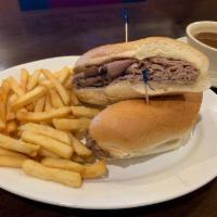 French Dip Sandwich · Sliced hot roast beef & melted mozzarella on a torpedo roll, with Au jus dipping sauce.