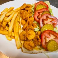shrimp po boy sandwich · Fried shrimp on a grilled torpedo roll with creole remoulade sauce, shredded lettuce,tomato,...