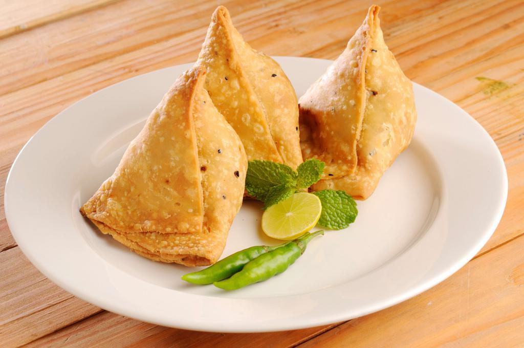 Samosa · 2 pieces. Our samosas are stuffed with potatoes, peas and spices.