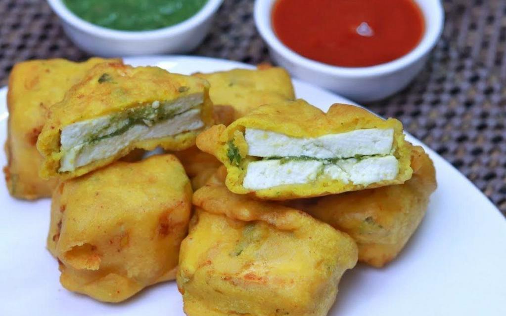 Paneer Pakora (4pcs) · 4 pieces. Large squares of paneer breaded and baked to a golden brown.