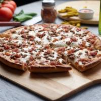 Cheeseburger Pizza · This pizza has our signature red sauce, fresh diced mozzarella, crunchy bacon and ground beef.