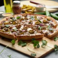 Spicy Lamb Kabob Pizza Twist · This pizza has our signature tandoori sauce, fresh diced mozzarella cheese, sliced lamb, cri...