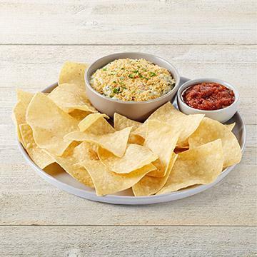Spinach & Artichoke Dip · Spinach, artichokes, Romano, sauteed onions & red bell peppers. Topped with Parmesan bread crumbs and served with tortilla chips & salsa.