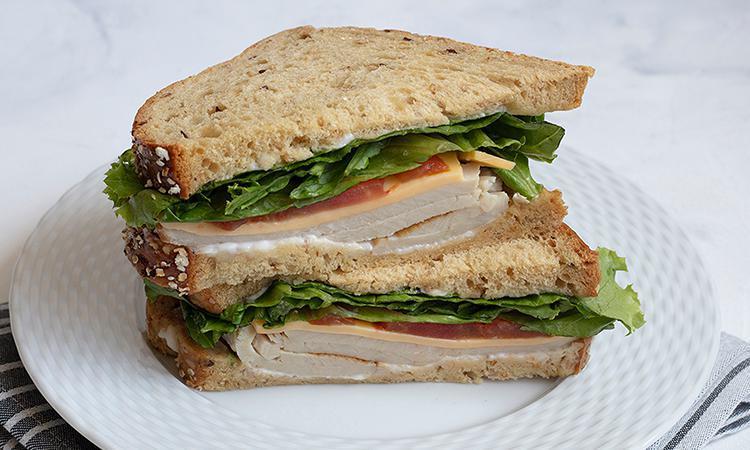 Turkey & Cheddar · Turkey, cheddar, tomato, lettuce and mayonnaise on multigrain bread. Please no substitutions or modifications.