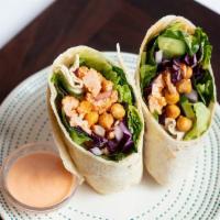 Buffalo Cauliflower & Chickpea Wrap · (vegan, dairy-free) Spicy cauliflower and chickpeas wrapped in a flour tortilla with red cab...